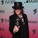 Richie Sambora poses with the Special International Award with Apple Music at the Ivor Novello Awards 2021 at Grosvenor House on September 21, 2021 in London, England