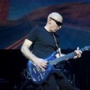 Joe Satriani performs as part of the G3 concert tour at Brooklyn Bowl Las Vegas at The Linq Promenade on January 17, 2018 in Las Vegas, Nevada - 454 x 328