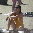 Sophie Gradon in Yellow Swimsuit on the beach in Barcelona