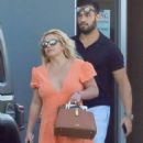 Britney Spears – Puts her diamond engagement ring on display at LAX in Los Angeles