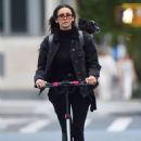 Nina Dobrev – Carries her dog on a backpack in New York