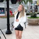 Kendra Wilkinson – In a black mini skirt shopping at Versace in Beverly Hills - 454 x 606