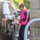 Lori Laughlin – In a bright pink jacket pump gas in Calabasas