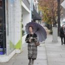 Claudia Wells – Shopping in the rain in Studio City - 454 x 681