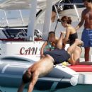 Retired football legend Ronaldo, 42, appears in great spirits as he takes a massive leap into the sea on fun-filled family trip in Spain - 454 x 681