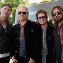 Chad Smith of Red Hot Chili Peppers, Matt Sorum, Glenn Hughes and Billy Ray Cyrus attend the John Varvatos 12th Annual Stuart House Benefit at John Varvatos on April 26, 2015 in Los Angeles, California. - 454 x 308
