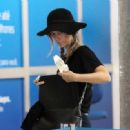Juliana Didone embarks on Sao Paulo airport