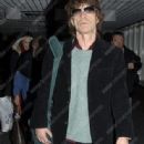 Mick Jagger and L'Wren Scott at Heathrow airport, London, Britain - 7 May 2011 - 315 x 700