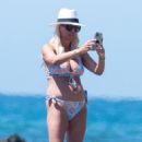 Denise Van Outen – Wearing a blue floral bikini on the beach in Marbella - 454 x 681