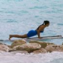 Kim Kardashian – Seen in a blue top bikini at the paddle boarding session in Turks - 454 x 303