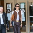 Bella Hadid – In a brown leather pants and snakeskin booties