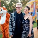 China Chow and Billy Idol attend the Moschino Spring/Summer 19 Menswear and Women's Resort Collection at Los Angeles Equestrian Center on June 8, 2018 in Burbank, California - 454 x 312