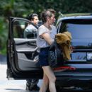 Milla Jovovich – Arrives at the Four Seasons in Los Angeles - 454 x 576