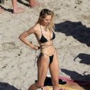 Alexis Ren – In a black bikini on the beach in St Barts - 454 x 611