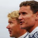 (L-R) Former McLaren team mates Mika Hakkinen and David Coulthard are seen together with historical Mercedes race cars before the German Formula One Grand Prix at the Nurburgring on July 24, 2011 in Nuerburg, Germany - 454 x 336