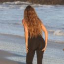 Khloe Kardashian – In Swimsuit on the beach in Malibu