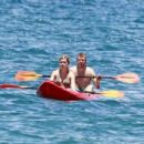 Jennette McCurdy wearing a pretty bikini and board shorts was spotted kayaking with a male friend in Maui