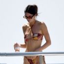 Kendall Jenner – Seen in multicolored bikini on a yacht in Capri