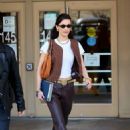 Bella Hadid – In a brown leather pants and snakeskin booties