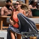 Laura Anderson – Seen in a coral swimsuit in Mykonos - 454 x 681