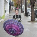 Claudia Wells – Shopping in the rain in Studio City - 454 x 681