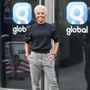 Dame Kelly Holmes – Wearing yellow bomber jacket and blond hair in London - 454 x 625