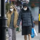 Suki Waterhouse and Robert Pattinson – Wearing matching face masks in London
