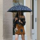 Famke Janssen – In a brown skirt in NY
