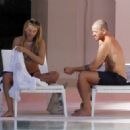 Arabella Chi – Seen by the pool with a mystery male friend in Ibiza - 454 x 326