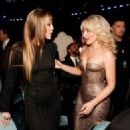 Miley Cyrus and Sabrina Carpenter - The 67th Annual Grammy Awards - Backstage - 454 x 324
