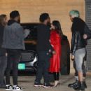 Megan Fox – In a red leather trench coat and PVC pants at Nobu Malibu