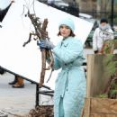 Zoey Deutch Wearing a baby blue full-length quilted coat on ‘The Politician’ set in NYC
