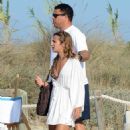 Retired footballer Ronaldo uses a selfie stick to take loved up holiday snaps in the sea with beach babe fiancé Paula Morais - 454 x 704