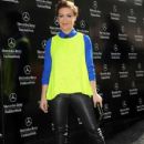 Alyssa Milano arrives at the Mercedes Benz Fashion Week tent at Lincoln Center in New York on Sept. 6, 2013