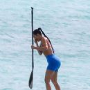 Kim Kardashian – Seen in a blue top bikini at the paddle boarding session in Turks - 454 x 681