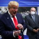 President Trump puts on his mask - 454 x 279