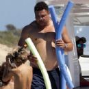 Retired football legend Ronaldo, 42, appears in great spirits as he takes a massive leap into the sea on fun-filled family trip in Spain - 306 x 509