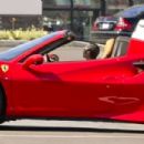 Blac Chyna – Enjoying a drive in her convertible red Ferrari