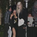 Fergie and Josh Duhamel pose for the cameras outside Kate Hudson's Halloween party in Brentwood in Los Angeles on Oct. 26, 2013