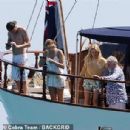 Queen's Roger Taylor uses a pole and shoots an AIRGUN at jellyfish whilst on a boat ride with his wife and children during sun-soaked holiday in Spain, 31 May 2019 - 306 x 307