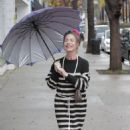 Claudia Wells – Shopping in the rain in Studio City - 454 x 681