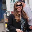 Kelly Brook – In a blue dress at Heart radio in London