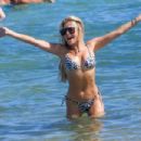 Sylvie Meis – Bikini candids at the beach in Saint Tropez - 454 x 303