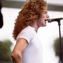 Robert Plant performing during Day on the Green at Oakland Coliseum in Oakland, CA on July 24, 1977 - 454 x 664