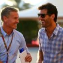 Mark Webber speaks with David Coulthard in the paddock before qualifying for the Abu Dhabi Formula One Grand Prix at Yas Marina Circuit on November 22, 2014 in Abu Dhabi, United Arab Emirates - 454 x 303