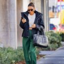 Shay Mitchell – Wearing Sarah Jessica Parker style rolled up sweatpants with heeled boots in LA