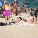 Lana Del Rey – In a beige one piece bathing suit on Ipanema beach in Rio - 454 x 303