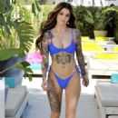 Darylle Sargeant in Blue Bikini on the pool in Ibiza - 454 x 685