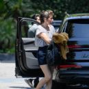 Milla Jovovich – Arrives at the Four Seasons in Los Angeles - 454 x 561