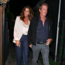 Cindy Crawford looks ultra-chic in a satin top and blazer as she heads out for a romantic dinner with husband Rande Gerber in Santa Monica